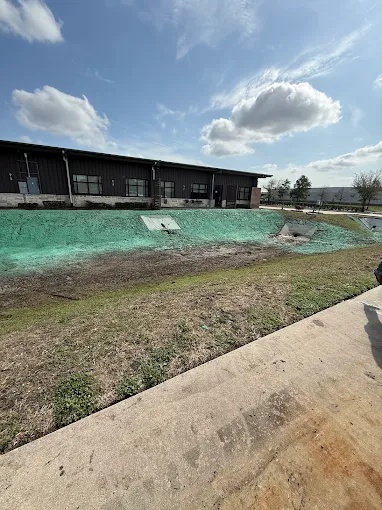 Commercial drainage green erosion control slope project in Houston TX by Leatherwood Lawn Specialists | commercial landscaping, lawn care, lawn maintenance, drainage, concrete, outdoor solutions near Houston TX Commercial drainage green erosion control slope project in Houston TX by Leatherwood Lawn Specialists