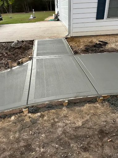 Concrete walkway installation by Leatherwood Lawn Specialists in Houston TX