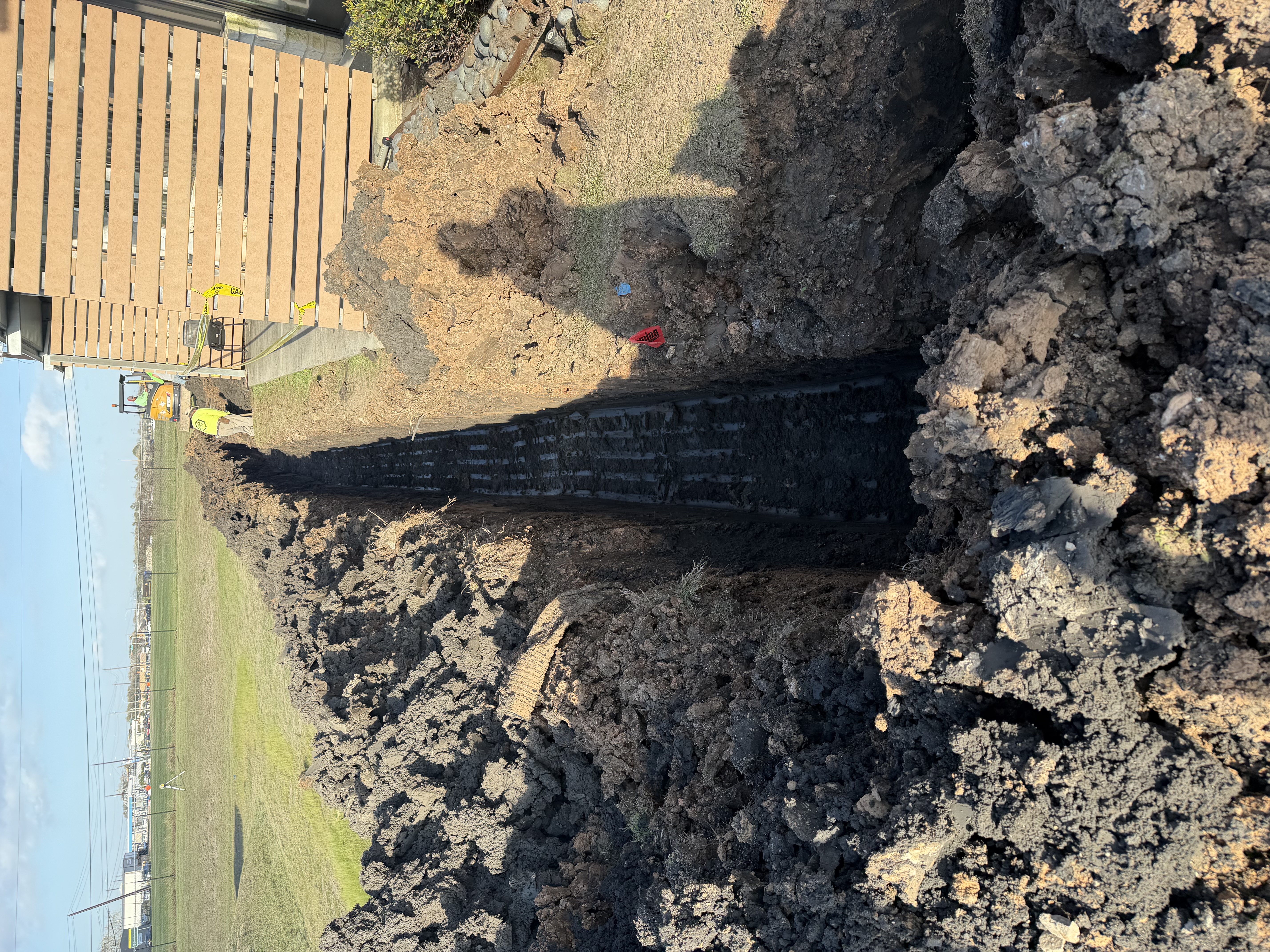 Drainage trench excavation project in Houston TX by Leatherwood Lawn Specialists | commercial landscaping, lawn care, lawn maintenance, drainage, concrete, outdoor solutions near Houston TX Drainage trench excavation project in Houston TX by Leatherwood Lawn Specialists