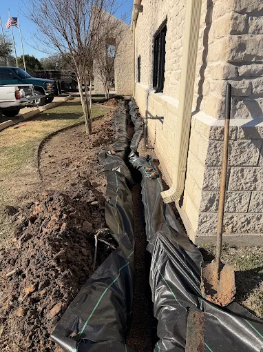 French drain installation project in Houston TX by Leatherwood Lawn Specialists | commercial landscaping, lawn care, lawn maintenance, drainage, concrete, outdoor solutions near Houston TX French drain installation project in Houston TX by Leatherwood Lawn Specialists
