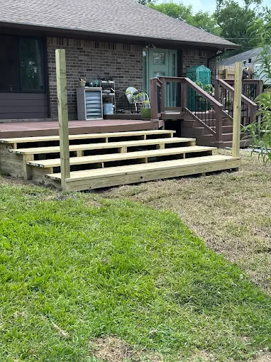 Outdoor living deck step installation in Houston TX by Leatherwood Lawn Specialists