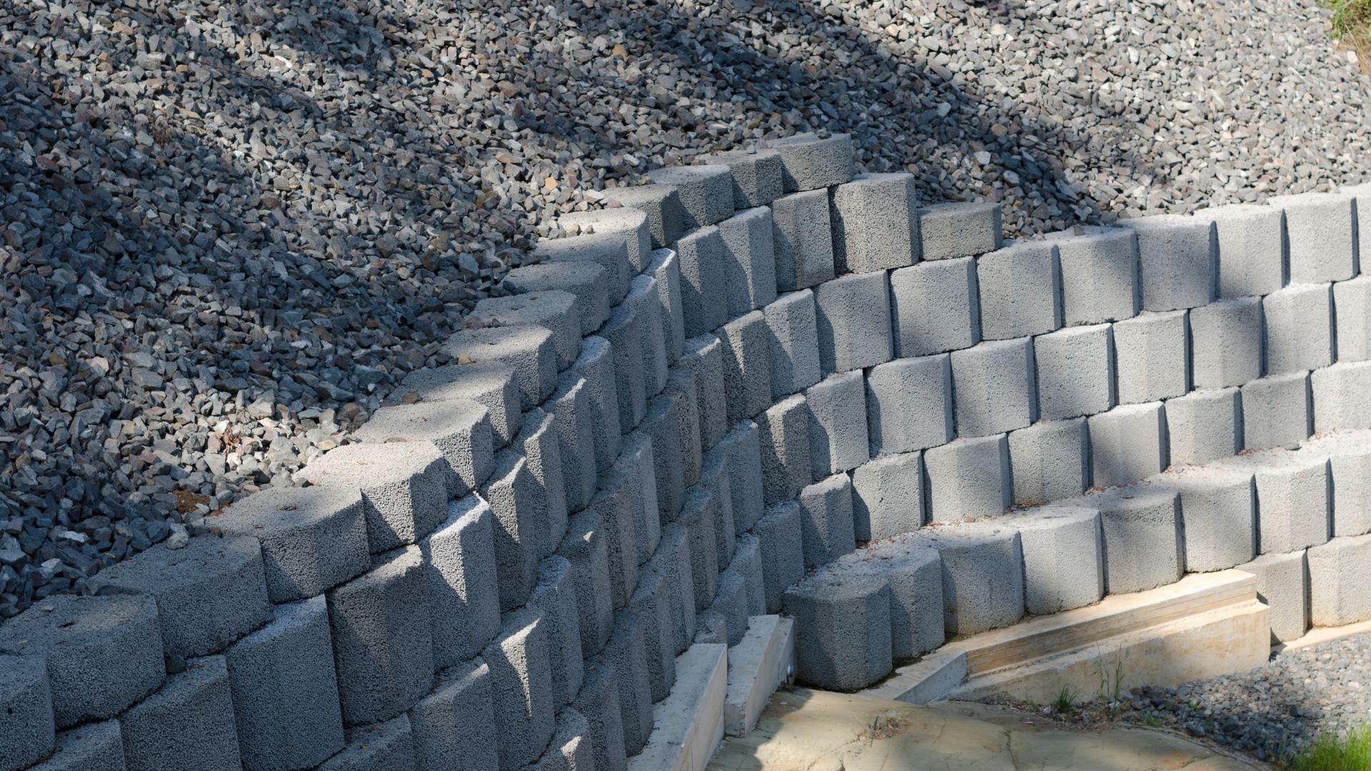 Retaining wall block installation for slope control in Houston TX by Leatherwood Lawn Specialists